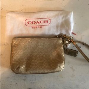 Gold coach wristlet